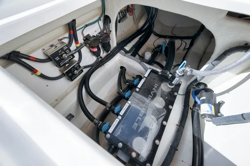 Slide: The Image of Engine compartment of 2025 Invincible 35 Catamaran showcasing wiring and components. - 41