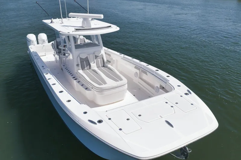 Slide: The Image of 2025 Invincible 35 Catamaran on water, showcasing sleek design and spacious deck layout. - 4