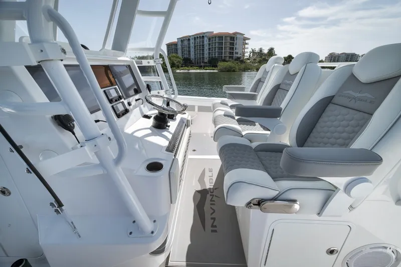 Slide: The Image of Interior of 2025 Invincible 35 Catamaran with modern helm and luxurious seating. - 29