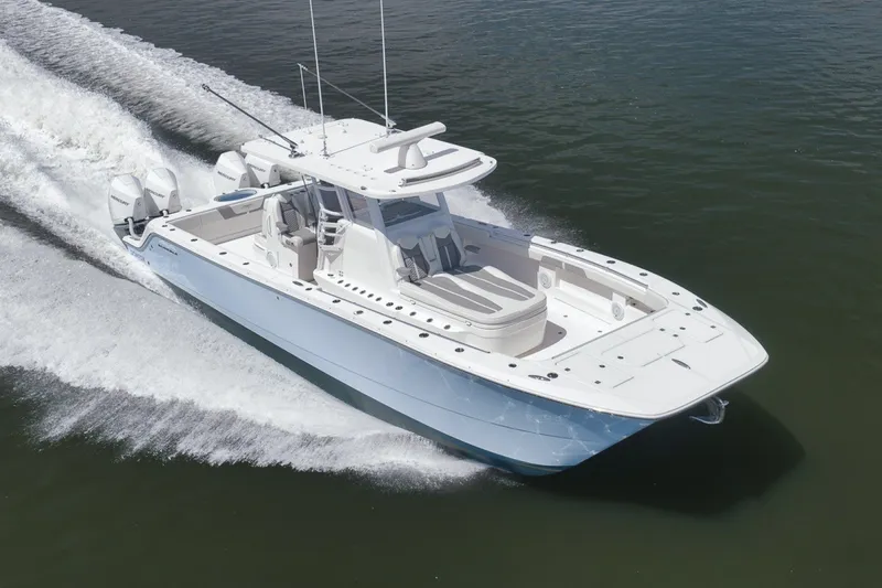 Slide: The Image of 2025 Invincible 35 Catamaran cruising on water, showcasing sleek design and powerful engines. - 50