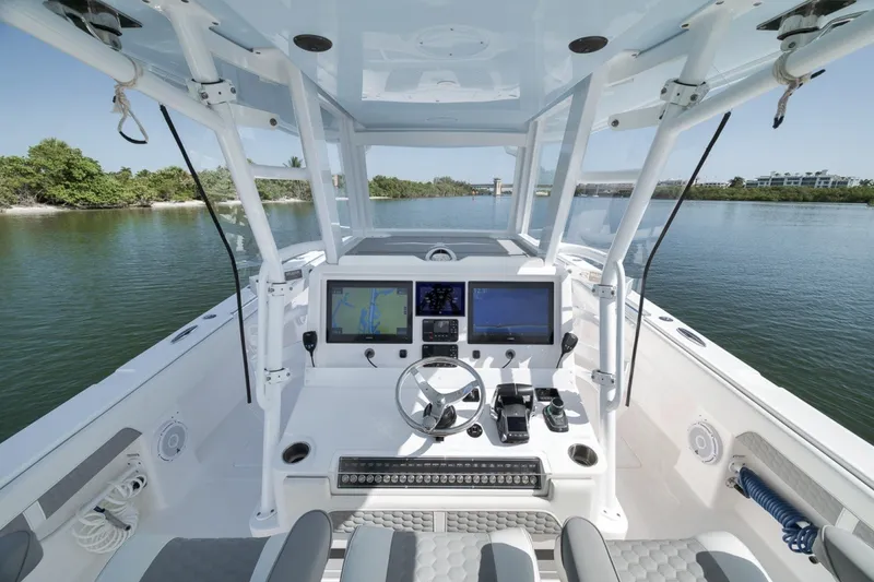 Slide: The Image of Cockpit view of 2025 Invincible 35 Catamaran with advanced navigation systems. - 34