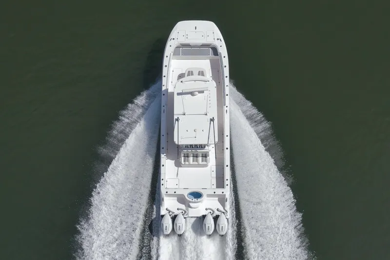 Slide: The Image of 2025 Invincible 35 Catamaran cruising on water, aerial view. - 51