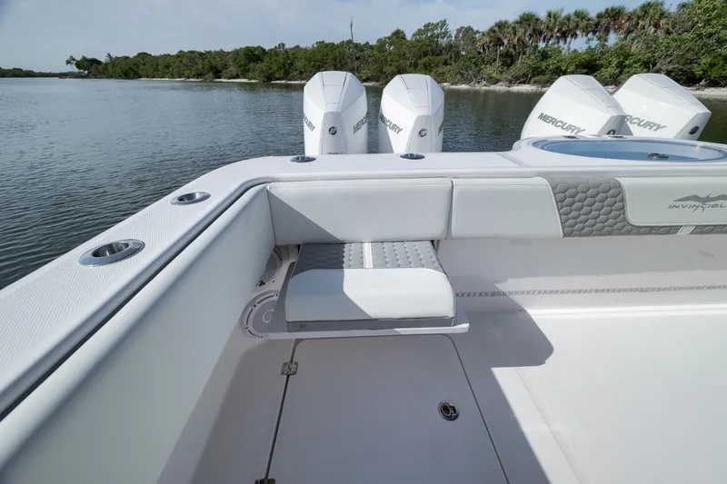 Slide: The Image of 2025 Invincible 35 Catamaran with Mercury engines, featuring sleek seating and modern design. - 42