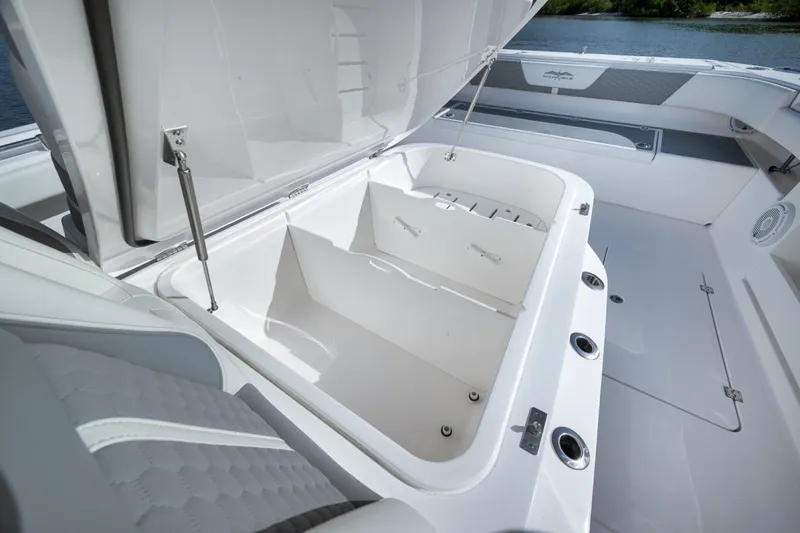 Slide: The Image of Open storage compartment on 2025 Invincible 35 Catamaran, showcasing spacious interior design. - 23