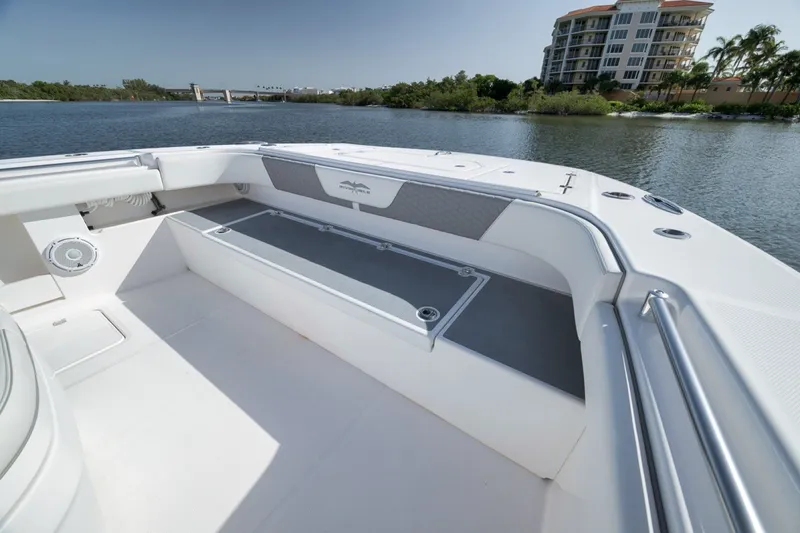 Slide: The Image of 2025 Invincible 35 Catamaran interior, featuring spacious seating and sleek design on calm waters. - 20