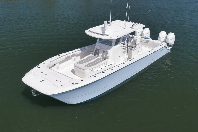 Slide: The Image of 2025 Invincible 35 Catamaran on water, showcasing sleek design and powerful engines. - 6