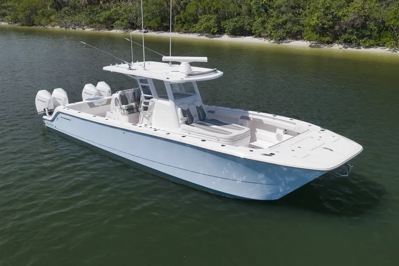 Slide: The Image of 2025 Invincible 35 Catamaran on calm water, featuring sleek design and powerful engines. - 3