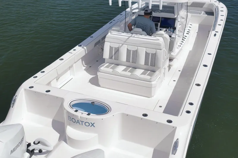 Slide: The Image of 2025 Invincible 35 Catamaran with sleek design and spacious seating on calm waters. - 46
