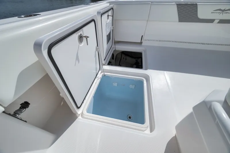 Slide: The Image of Open storage compartments on 2025 Invincible 35 Catamaran deck, showcasing spacious design. - 40