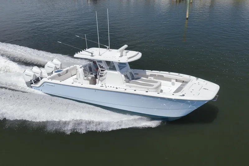 Slide: The Image of 2025 Invincible 35 Catamaran cruising on water, showcasing sleek design and powerful engines. - 14