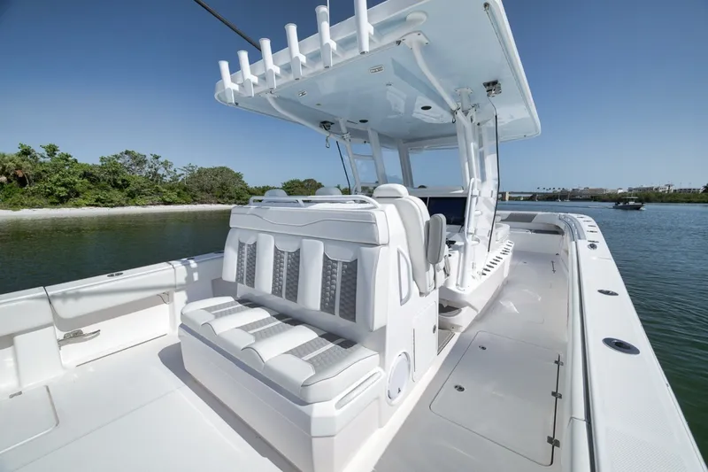 Slide: The Image of 2025 Invincible 35 Catamaran with sleek seating and modern design on calm waters. - 36