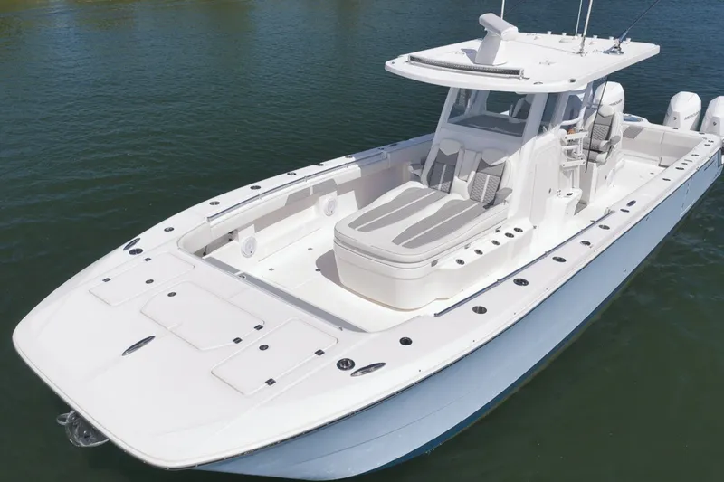 Slide: The Image of 2025 Invincible 35 Catamaran on water, showcasing sleek design and spacious deck layout. - 5