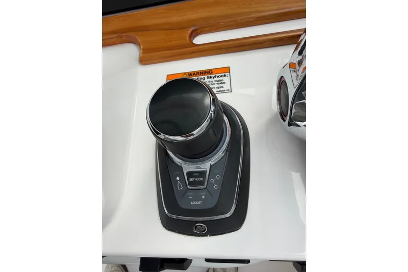 Slide: The Image of 2024 Southport 33 DC boat control panel with joystick and Skyhook feature. - 31