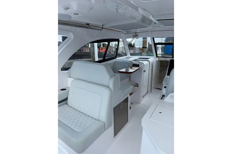 Slide: The Image of 2024 Southport 33 DC boat interior with luxurious seating and modern design. - 36