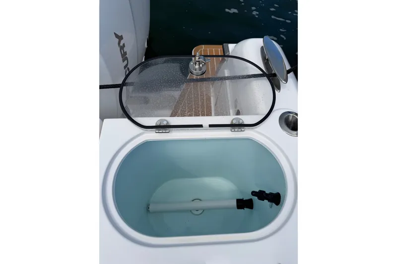Slide: The Image of Livewell on 2024 Southport 33 DC boat, featuring a transparent lid and water inlet. - 25