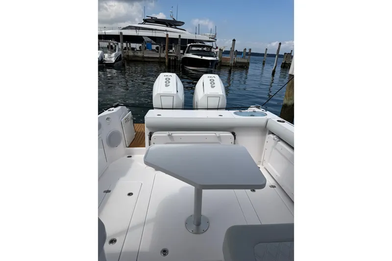 Slide: The Image of 2024 Southport 33 DC boat with dual engines docked at marina. - 10