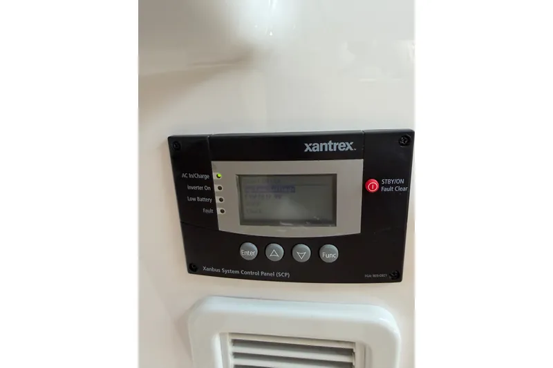Slide: The Image of Xantrex control panel on 2024 Southport 33 DC boat, displaying system status. - 19