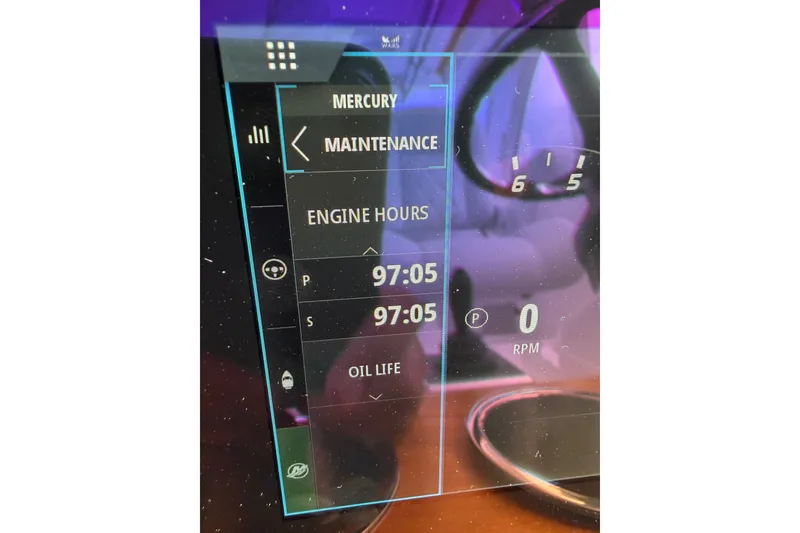 Slide: The Image of 2024 Southport 33 DC dashboard displaying engine hours and maintenance details. - 22