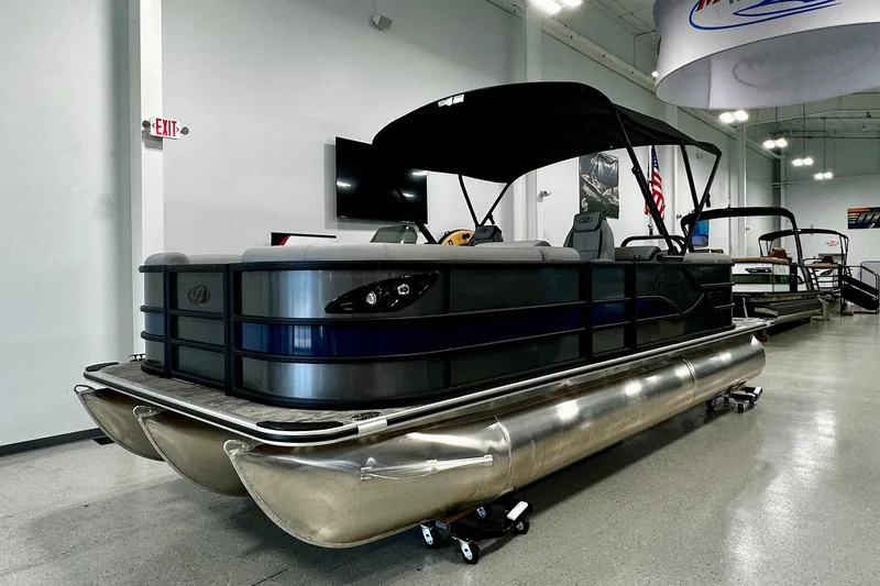 The Image of 2027 Bentley Pontoons Legacy 223 Navigator in showroom, featuring sleek design and modern amenities. - 0