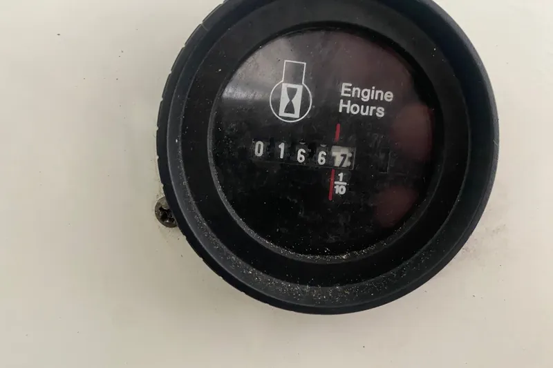 Slide: The Image of Cobalt 206 2002 engine hour meter displaying 167.7 hours. - 11