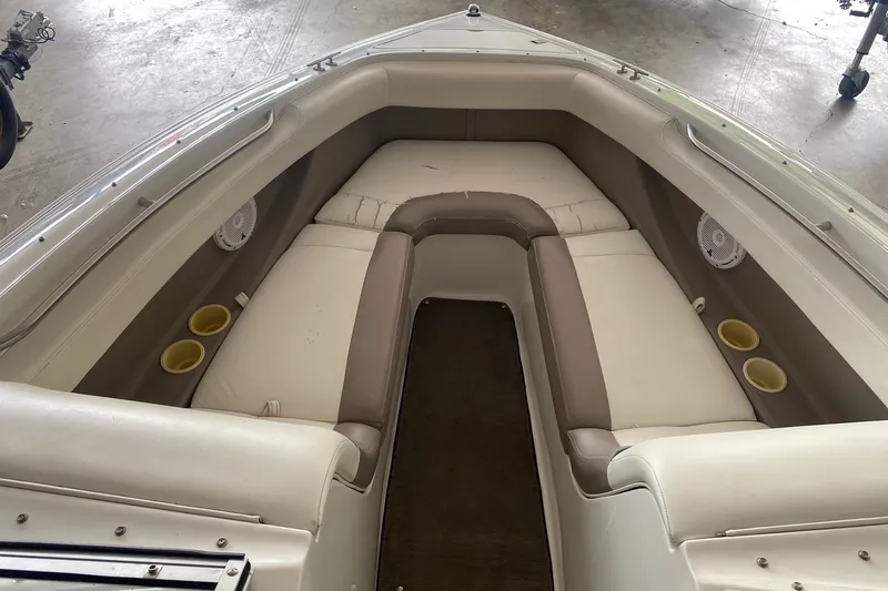 Slide: The Image of Interior of 2002 Cobalt 206 boat with beige seating and cup holders. - 8