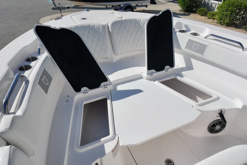 Slide: The Image of 2027 Sea Fox 228 Commander boat interior with open storage compartments and seating. - 9