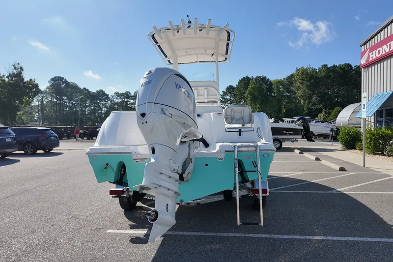 Slide: The Image of 2027 Sea Fox 228 Commander boat with Yamaha outboard motor in a parking lot. - 3