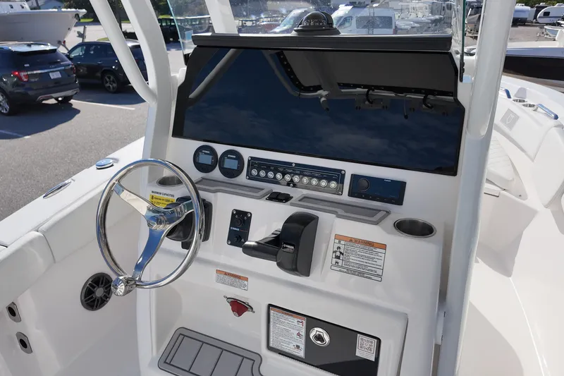 Slide: The Image of 2027 Sea Fox 228 Commander boat dashboard with steering wheel and controls. - 8