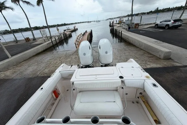 Slide: The Image of 2003 Grady-White Advance 257 boat at a dock with twin engines, ready for launch. - 12