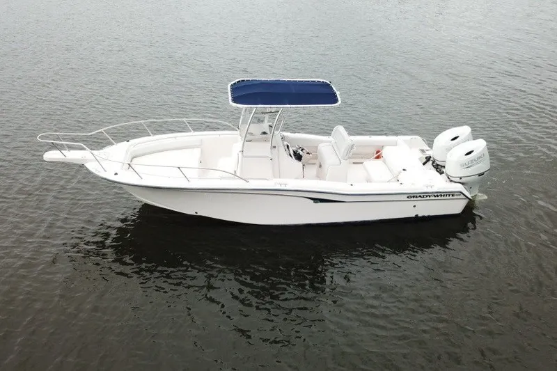 The Image of 2003 Grady-White Advance 257 boat with dual engines on calm water. - 0