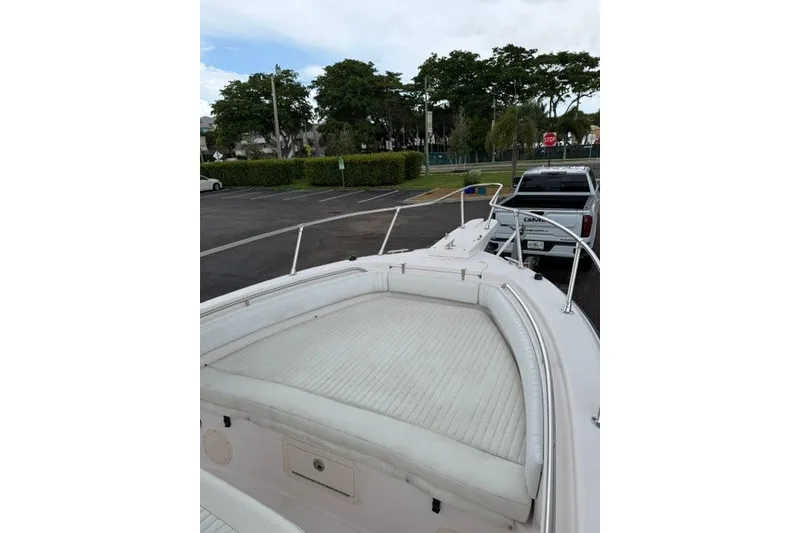 Slide: The Image of 2003 Grady-White Advance 257 boat parked, featuring spacious bow seating and sleek design. - 9