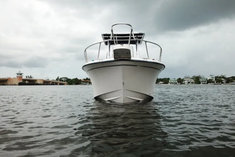 Slide: The Image of 2003 Grady-White Advance 257 boat on water under cloudy sky. - 4