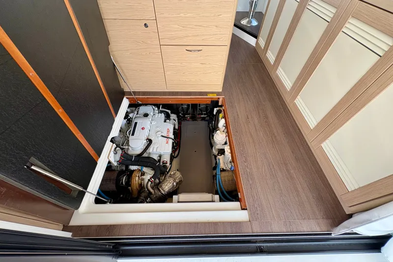 Slide: The Image of Engine compartment of 2025 Beneteau Swift Trawler 48, showcasing modern marine engineering. - 31