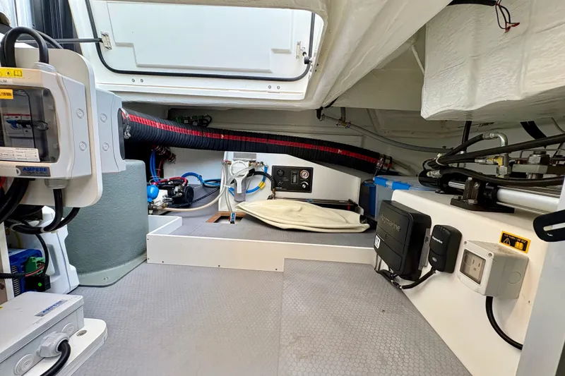 Slide: The Image of Engine room of 2025 Beneteau Swift Trawler 48, showcasing modern equipment and wiring. - 35