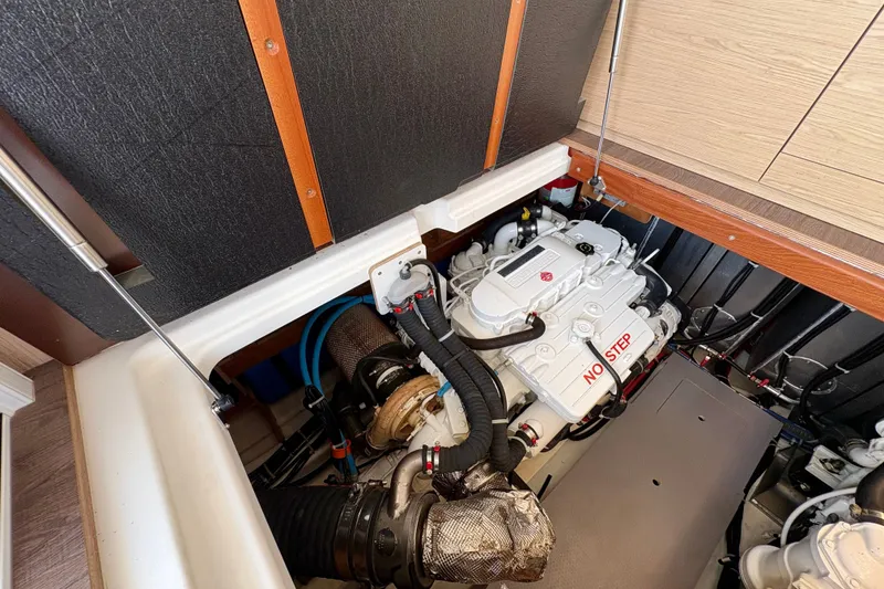 Slide: The Image of Engine room of 2025 Beneteau Swift Trawler 48, showcasing detailed mechanical components. - 33
