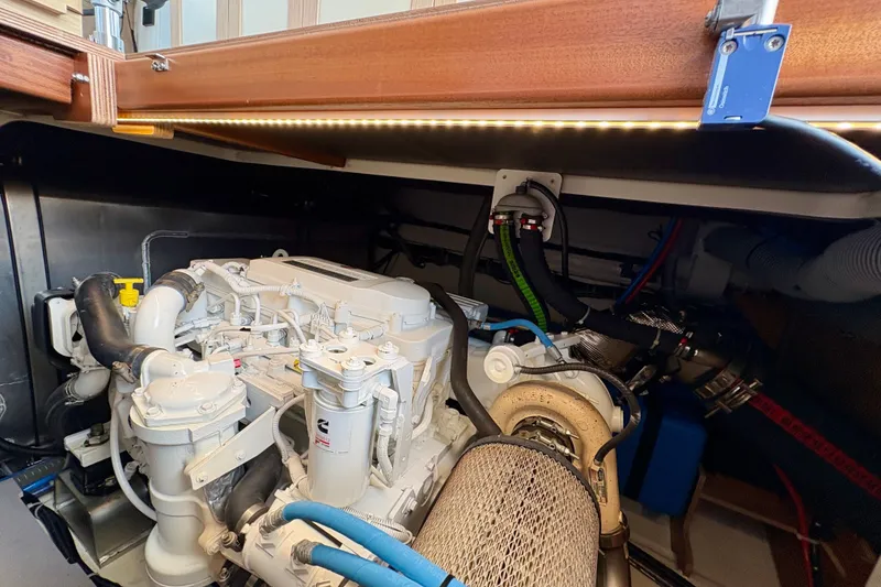 Slide: The Image of Engine room of 2025 Beneteau Swift Trawler 48, showcasing detailed mechanical components. - 34