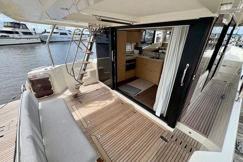 Slide: The Image of 2025 Beneteau Swift Trawler 48, featuring spacious deck and modern interior design. - 25