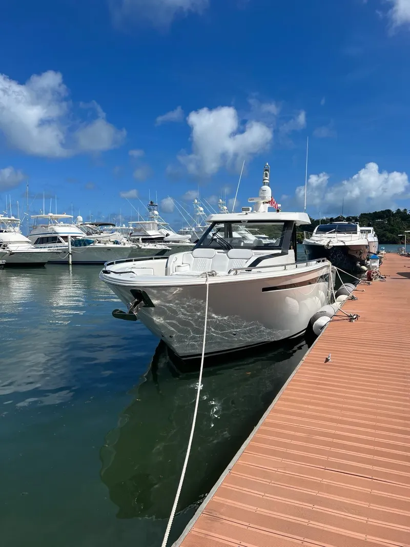 Slide: The Image of 2020 Ocean Alexander 45 Divergence yacht docked at a marina on a sunny day. - 17