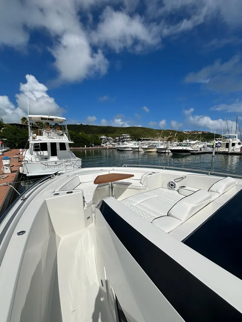 Slide: The Image of 2020 Ocean Alexander 45 Divergence yacht docked at a marina under a blue sky. - 15