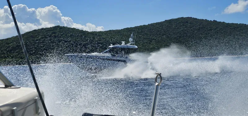 Slide: The Image of 2020 Ocean Alexander 45 Divergence cruising on the water near a lush green island. - 13