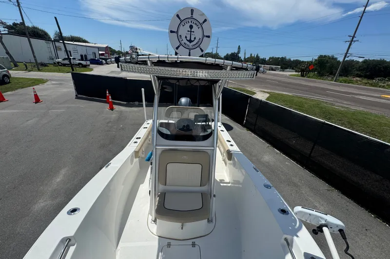 Slide: The Image of 2016 Sea Fox 206 Commander boat with center console, parked on a sunny day. - 30