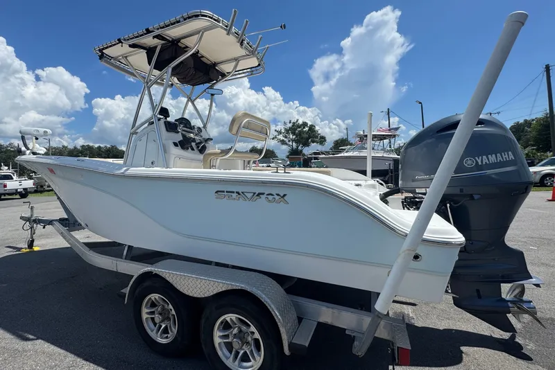 Slide: The Image of A 2016 Sea Fox 206 Commander on a trailer, featuring a Yamaha outboard motor. - 11