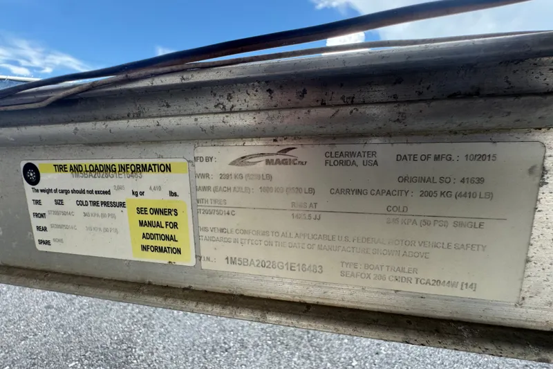 Slide: The Image of Label on Sea Fox 206 Commander boat trailer, detailing tire and loading information. - 50