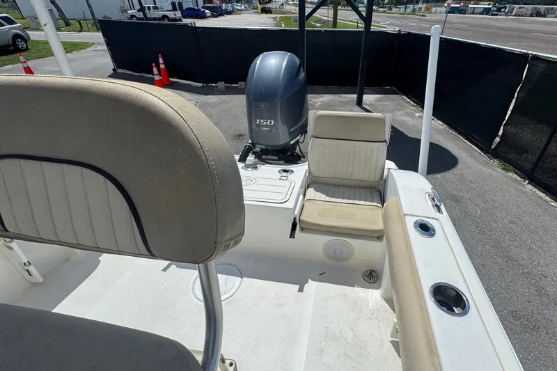 Slide: The Image of 2016 Sea Fox 206 Commander boat interior with seating and outboard motor. - 42
