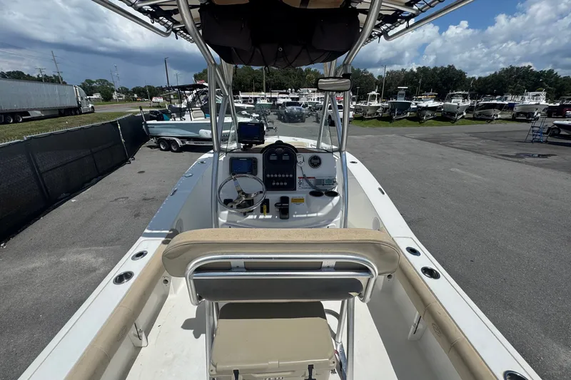 Slide: The Image of The image shows the cockpit of a 2016 Sea Fox 206 Commander with a helm console and seating. - 19