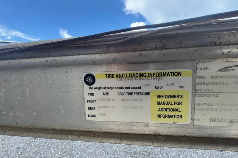 Slide: The Image of Tire and loading information label on a 2016 Sea Fox 206 Commander boat trailer. - 51