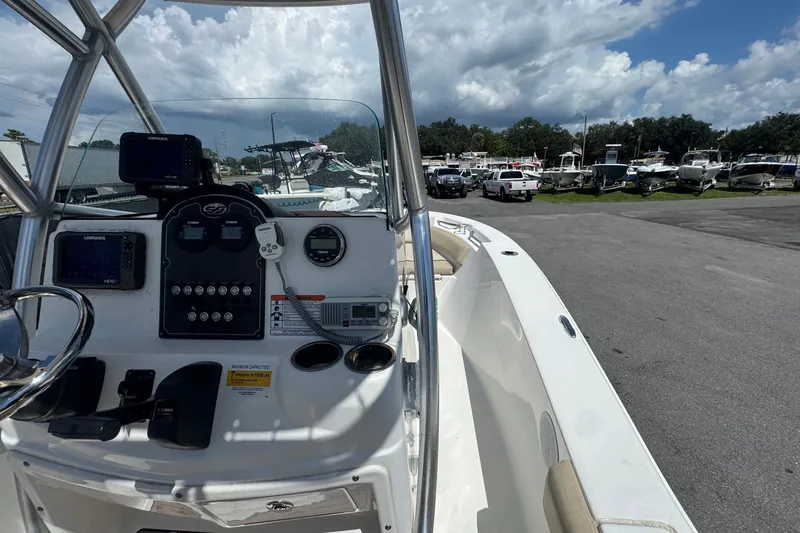 Slide: The Image of The image shows the cockpit of a 2016 Sea Fox 206 Commander with a helm console and electronics. - 21
