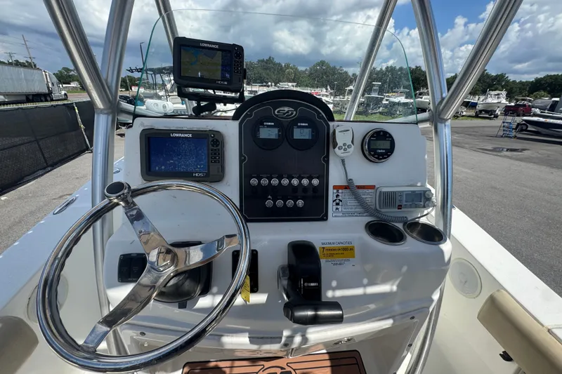 Slide: The Image of 2016 Sea Fox 206 Commander boat dashboard with navigation equipment and steering wheel. - 26