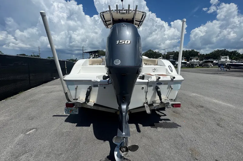 Slide: The Image of A 2016 Sea Fox 206 Commander with a 150 HP outboard motor, parked on a trailer. - 6
