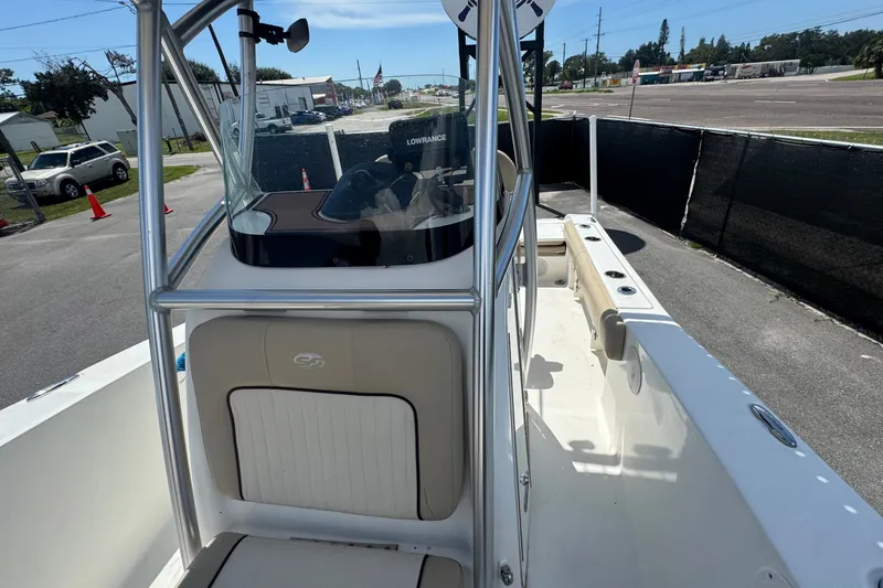 Slide: The Image of 2016 Sea Fox 206 Commander boat interior with console and seating, parked outdoors. - 34
